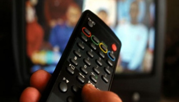 Hand-holding-TV-remote-co-007-1021x580